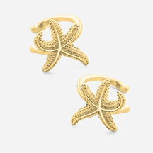 Goldene Seestern Earcuffs maritimer Schmuck auf weißem Hintergrund